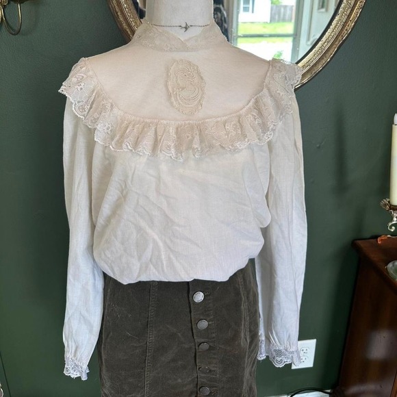 American Vintage Tops - White lace blouse with embroidered face detail